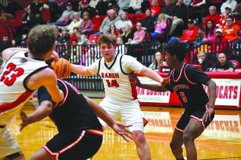 Wesley Branch/The Clayton Tribune. Rabun County freshman Cord Burrell sets up senior Hayes Free with a backdoor pass in Rabun County’s 80-47 first round playoff win over Chattooga on Feb. 24. 