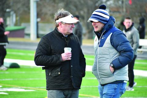 Wesley Branch/The Clayton Tribune. Georgia head football coach Kirby Smart and East Tennessee State head football coach Will Healy talk during the Rabun Gap College Coaches Social on Jan. 28. Multiple players in attendance received a scholarship offer from Georgia following the event, and Rabun Gap’s Jaxon Totherow received an offer from ETSU, marking his first Division I offer. 