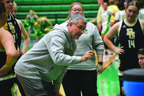 Wesley Branch/The Clayton Tribune. Rabun Gap head girls basketball coach Dale Earnhardt directs his team during a timeout in its Jan. 30 game against Buford. Earnhardt recently notched his 450th career victory as a head basketball coach. 