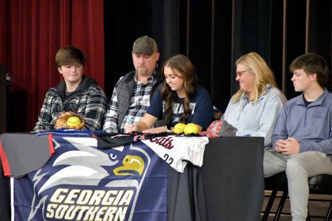 Wesley Branch/The Clayton Tribune. Rabun County softball senior Presley Burrell signs her letter of intent to Georgia Southern University East Georgia while accompanied by her family on Rabun County’s campus on Feb. 5. Burrell earned All-Region second-team honors in her senior season. 