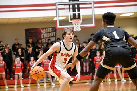 Wesley Branch/The Clayton Tribune. Rabun County senior Huey Blalock sizes up Commerce defender Jeremiah Jarrells in Rabun County’s 62-50 win over Commerce on Feb. 12. Blalock scored a game-high 29 points in the win. 