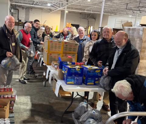 Photo courtesy of the Rotary Club of Clayton. Rotarians pack lunches for those in need at the Food Bank of Northeast Georgia. The service project is ongoing and part of many projects to benefit the Rabun County community. Service has been the focus of the organization, with Rotary members and Impact Club participants volunteering.