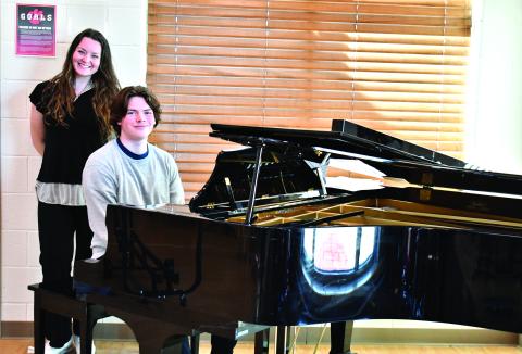 Megan Horn/The Clayton Tribune. Choir Teacher Tessa Backer, left, was selected as the 2025-2026 STAR Teacher by STAR Student Gavin Sharpe, who sits at the piano. Sharpe enjoys playing the piano and composing music, and said Backer has been an influential role model for him in music. 