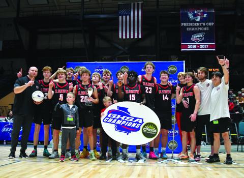 Enoch Autry/The Clayton Tribune. The Rabun County boys basketball team poses after its 52-43 state championship win versus Southwest on March 13 at the Macon Coliseum. The Wildcats set a school record with 30 wins and secured their first state title this season.