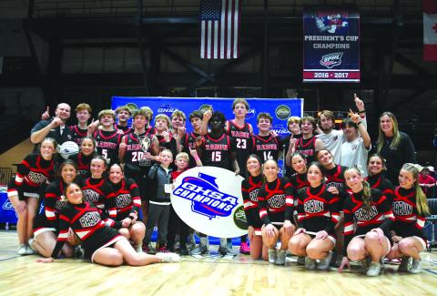 Enoch Autry/The Clayton Tribune. The Rabun County boys basketball team and RCHS cheerleaders pose for a photo after the basketball team's 52-43 state championship victory versus Southwest on March 13 at the Macon Coliseum