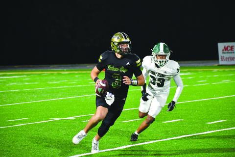 Enoch Autry/The Clayton Tribune. Rabun Gap’s quarterback Grayson Clary looks down field against Christ School during their NCISAA Nov. 7, 2025, playoff matchup.