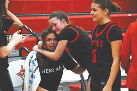 Wesley Branch/The Clayton Tribune. Rabun County sophomore Maci Dixon consoles Rabun County senior Loren Mazarky after the Lady Cats’ 46-44 loss to Thomasville in the Elite Eight on March 3 at Thomasville High School. Mazarky is one of five senior players for the Lady Cats. 