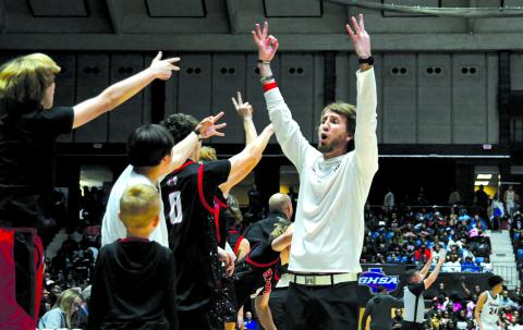 Enoch Autry/The Clayton Tribune. Rabun County boys basketball head coach David Adcock and his Wildcat bench celebrate a 3-point shot by senior Huey Blalock in the 52-43 win on March 13 for the Class A Division I state championship.
