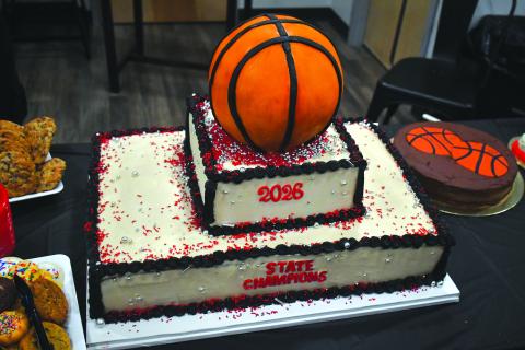 Wesley Branch/The Clayton Tribune. The Rusty Baker made a cake for the event, provided by the RCHS Athletic Booster Club to celebrate the state championship team at Wildcat Grill on March 19. 
