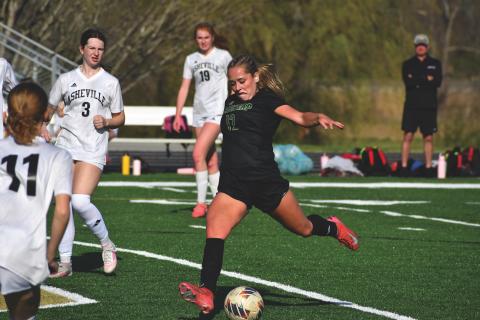 Wesley Branch/The Clayton Tribune. Rabun Gap junior Maile Sirois pushes the ball down the field in Rabun Gap’s 3-0 loss to Asheville High School at home on March 23. Sirois is one of three captains for the Eagles, who are 4-4 on the season. 