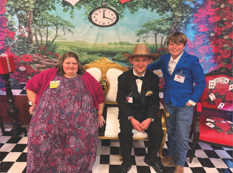 Katie Hamby/The Clayton Tribune. Shelby English of Clayton and Zack Montgomery of Mountain City sit next to volunteer Mason Beck. 