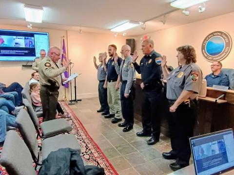 Megan Horn/The Clayton Tribune. Sky Valley Police Department officers are sworn-in as deputies with the Rabun County Sheriff’s Office during the March 17 city council meeting at Sky Valley City Hall. The partnership allows Sky Valley Police officers to assist the sheriff’s office whenever needed.