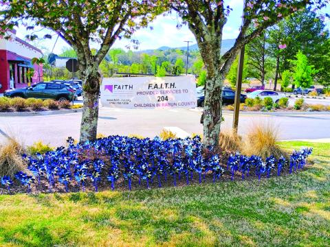 Megan Horn/The Clayton Tribune. Blue pinwheels can be seen spinning at Chick-fil-A Clayton. Each pinwheel represents a child in Rabun County who was helped by local nonprofit Fight Abuse In The Home (F.A.I.T.H.) last year. F.A.I.T.H. provided services to 204 children in Rabun County in 2025. Pinwheels can also be seen at the Rabun County Division of Family and Children Services (DFCS) office. April is Child Abuse Prevention Month. 