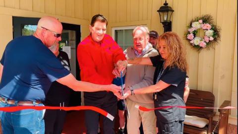 Photo courtesy of Forward Rabun/Rabun County Chamber of Commerce.  Community members and the Majors celebrate the 20th anniversary on Cannonwood Retirement Home in Tiger. The Majors also own the Tiger Drive-In which is next door to Cannonwood.