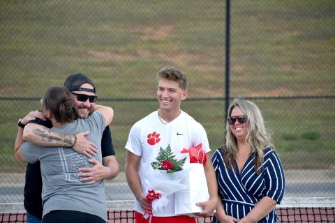 Wesley Branch/The Clayton Tribune. Rabun County senior Ashden Denning smiles as he is recognized for senior night before Rabun County’s match versus Commerce on April 2. Denning has played tennis at RCHS since his sophomore year. 