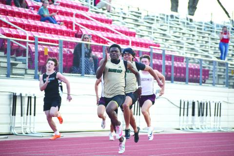 Wesley Branch/The Clayton Tribune. Rabun Gap senior CJ Willingham runs during the track events at the Bo James Invitational at Rabun County High School on April 2. Willingham set new Bo James Invitational records for the 100 and 200-meter races with times of 10.81 and 21.94, respectively. 