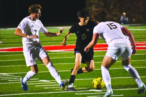 Wesley Branch/The Clayton Tribune. Rabun County sophomore Carlos Lopez-Justice navigates the White County defense in Rabun County’s 1-0 win against White County on April 3. Lopez-Justice drew multiple fouls throughout the contest, creating scoring opportunities for the Wildcats and frustrating the Warriors’ defenders. 