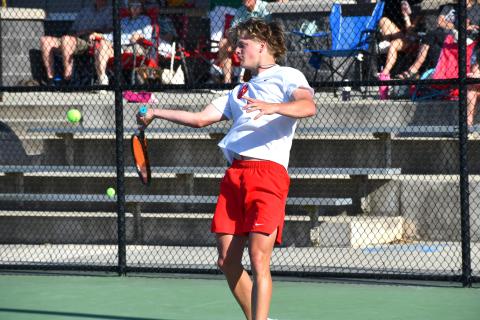 Wesley Branch/The Clayton Tribune. Rabun County junior Landan Bedingfield prepares to strike the ball in Bedingfield and Brady Darnell’s doubles match on April 15 at Victory Lord Park in Winder, Ga., in the region tournament championship versus Athens Academy. Bedingfield and Darnell defeated the Spartans’ duo of  Price West and Jack Roberts, who were undefeated going into the match. 