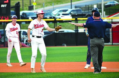 Enoch Autry/The Clayton Tribune. Senior second baseman Ty Truelove tries to convince the umpire he got the tag on Elbert County baserunner Brody Baker, but Baker is called safe in the Blue Devils’ 7-3 win over the Wildcats on March 31.