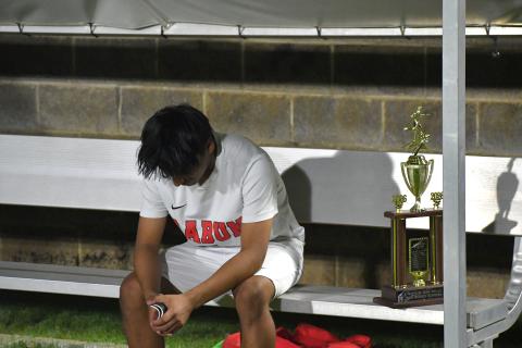 Wesley Branch/The Clayton Tribune. Rabun County sophomore Alan Lozada sits on the bench in disbelief after the Wildcats’ loss in PKs to Athens Academy on April 15. Next to Lozada is the region runner-up trophy, which the Wildcats claimed for the second straight year. 