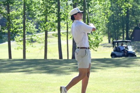 Wesley Branch/The Clayton Tribune. Rabun County senior Ty Truelove holds his follow through as he watches his shot during Rabun County’s golf match versus Union County on April 16 at Kingwood Resort. Truelove shot a season best 38 on the afternoon. 