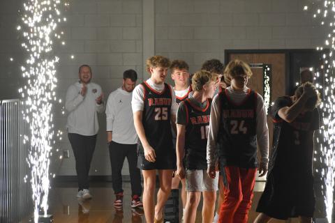 Wesley Branch/The Clayton Tribune. The Rabun County High School basketball team walks onto the floor for its championship celebration on RCHS’ campus on March 26. 