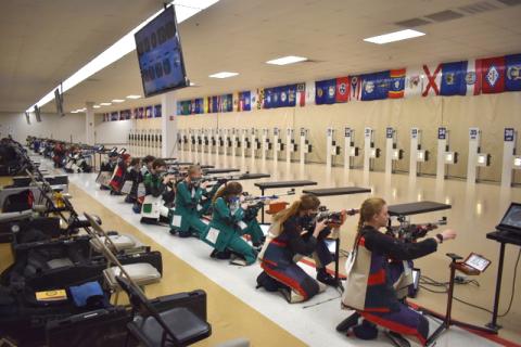 Submitted photo. Rifle team members including Tallulah Falls (center) take aim at in the regional championship in Alabama.