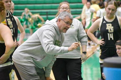 Wesley Branch/The Clayton Tribune. RGNS head girls basketball coach Dale Earnhardt directs his team during a timeout against Buford. 