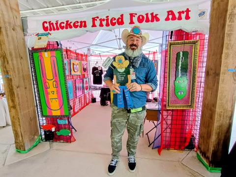 Megan Horn/The Clayton Tribune. Chris Allison features his Chicken Fried Folk Art at last weekend’s Dingerfest event held at the pavilions in downtown Clayton.  