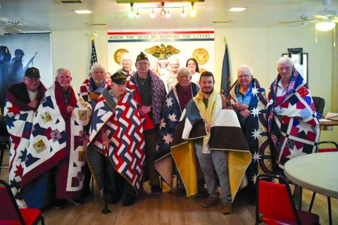 Enoch Autry/The Clayton Tribune. Nine veterans were in attendance at Veterans of Foreign Wars Post 4570 on June 19 to receive Quilts of Valor as each of the quilts took approximately 200 hours to stitch.