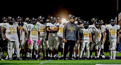 Submitted photo. Quinnon Isom (middle) prepares to lead his team onto the field before kickoff during his head coaching stint at Union County High School in Union, S.C. Isom’s hiring at Rabun Gap brings him closer to home as he is from Toccoa, Ga., and played high school football at Stephens County.  