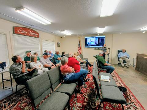 Megan Horn/The Clayton Tribune. Many community members attended the evening meeting of the Sky Valley City Council on Tuesday, June 16. Citizens listen as Police Chief Ron Baumes gives his department report and discusses the benefits of having Flock Safety cameras in city limits. 