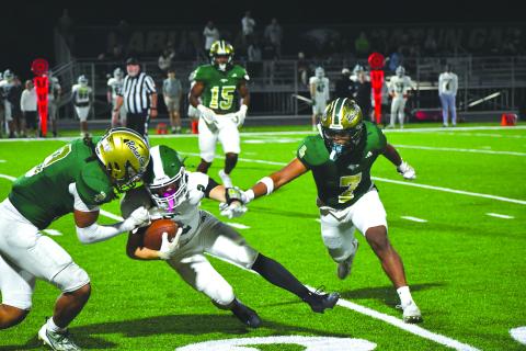 Wesley Branch/The Clayton Tribune. Rabun Gap linebackers Kaylan Brown (left) and Praise Chane (right) close in on a Christ School ball carrier in the Eagles’ 42-0 regular season win over the Greenies on Oct. 17, 2025. Brown announced his commitment to East Tennessee State last week and Chane announced his commitment to Navy. 