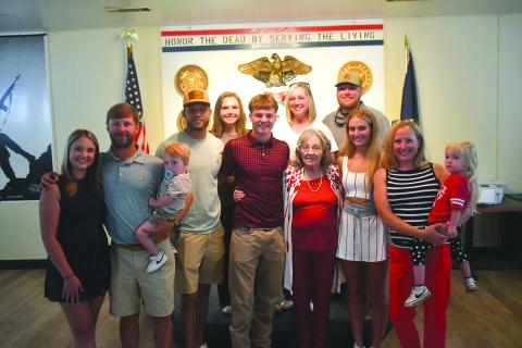 Wesley Branch/The Clayton Tribune. Huey Blalock (center) poses with his family for a photo after being administered his oath of service at VFW Post 4570 in Clayton on June 24. Blalock, who is a midshipman candidate, will head to NAPS, the Naval Academy’s 10-month preparatory school. Blalock was an All-State basketball player for Rabun County.