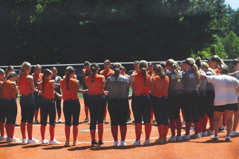 Wesley Branch/The Clayton Tribune. Rabun County and Habersham Central players gather to pray together after the teams completed their July 20 scrimmage at Rabun County High School. The Lady Cats are led by third-year head coach Jessica Evans.