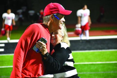Wesley Branch/The Clayton Tribune. Rabun County head football coach Rance Gillespie (left) hugs his mother Glenda Rogers after Rabun County’s “Midnight Madness” practice. Gillespie is heading into his second year as Rabun County’s head football coach. 