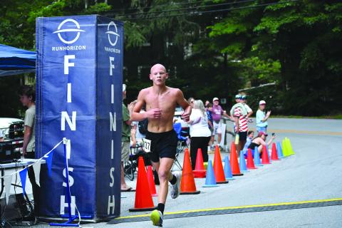 Enoch Autry/The Clayton Tribune. Andrew Wall, 15, wins the Rabun Ramble 5K on Independence Day in Lakemont. Wall is a rising sophomore at Rabun County High School.