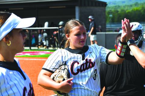 Wesley Branch/The Clayton Tribune. Rabun County’s Jaylynn Gragg receives a high five after completing an inning in the Lady Cats’ 20-3 win over Tallulah Falls on Aug. 16, 2025. Gragg will be one of four potential starting pitchers for RCHS this upcoming season. 