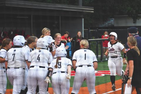 Wesley Branch/The Clayton Tribune. The Rabun County softball team celebrates River Evans’ go-ahead grand slam in the bottom of the sixth inning of the Wildcats’ 15-14 win against East Jackson on Aug. 3. Evans, a junior, went 3-for-4 on the night with a single, double and grand slam.
