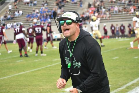 Wesley Branch/The Clayton Tribune. Rabun Gap head football coach Derek White directs his team on the sideline during Rabun Gap’s Aug. 14 scrimmage versus Westside (S.C.). RGNS will face Venice (Fla.) on Aug. 21 at home to open the season. 