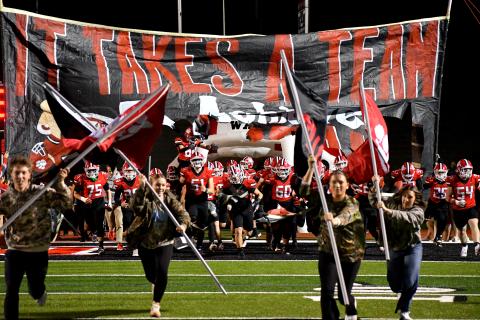 Wesley Branch/The Clayton Tribune. Rabun County High School’s football team runs onto the field before its second-round playoff game versus Berrien last season. The Wildcats enter 2026 following a 10-3 record and run to the state quarterfinals a season ago.