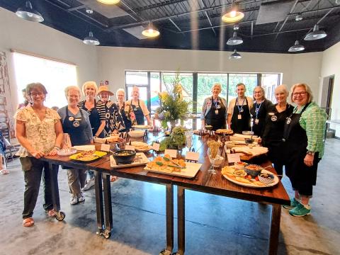 Megan Horn/The Clayton Tribune. The Food Bank of Northeast Georgia Teaching Kitchen held an Open House for the community on Thursday, July 16. Pictured are Chef Inger Smith, director of education and entrepreneurship; and Teaching Kitchen volunteers Frances Daniel, Jackie Baumgartner, Nancy Parrott, Cyndi Israel, Susan Schueller, Debbie Brunen, JT Holly, Susie Holly, Mary Miller and Annette Branan. Not pictured is Teaching Kitchen volunteer Joanne Baumgartner. 