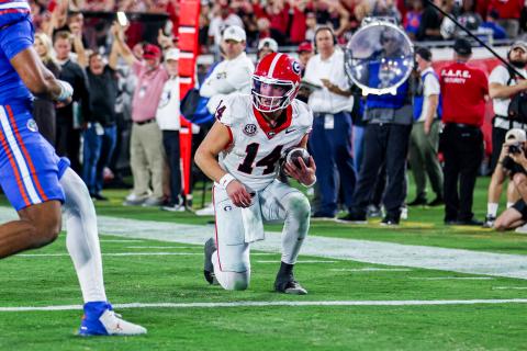 Photo courtesy UGAAA. Georgia quarterback Gunner Stockton takes a knee to preserve a 24-20 win on Nov. 1, 2025, for the Dawgs over Florida by running out the clock.