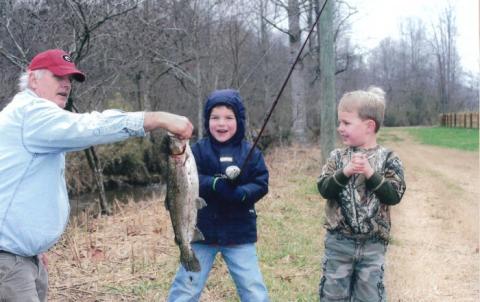 Photo courtesy Stockton family.  Former Rabun County assistant coach George Bobo along with Gunner Stockton and Drew Bobo in Rabun County when the now Georgia football players were growing up.