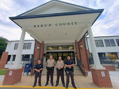 Megan Horn/The Clayton Tribune. The sheriff is mandated by law to provide the security of the Rabun County courthouse and the safety of superior court judges, magistrates, support staff and citizens who visit the county courthouse. The agency’s Judicial Process and Criminal Process Sections also serve in this division. Bailiffs pictured are Sgt. Tony Parrish, who oversees courthouse security, Steve Osborne, Daniel Nicholson and Joseph Silva.