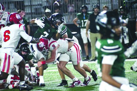 Wesley Branch/The Clayton Tribune. Rabun County linebacker Brock Brady forces a fumble from Walnut Grove’s Julian Sease during the Wildcats’ 17-3 loss to the Warriors on Sept. 11. Brady finished the game with 16 total tackles.