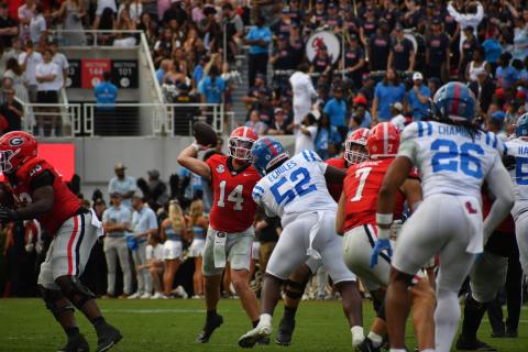 Wesley Branch/The Clayton Tribune. Former Rabun County standout and current Georgia starting quarterback Gunner Stockton prepares to release his pass around Ole Miss defensive lineman Will Echoles Sanford Stadium on Oct. 18, 2025.