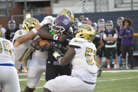 Wesley Branch/The Clayton Tribune. The Rabun Gap defense brings down Ambassador Christian School running back Ezekiel Kelly during its 31-6 win over the Lions on Sept. 25. RGNS’ defense forced three turnovers in the victory. 