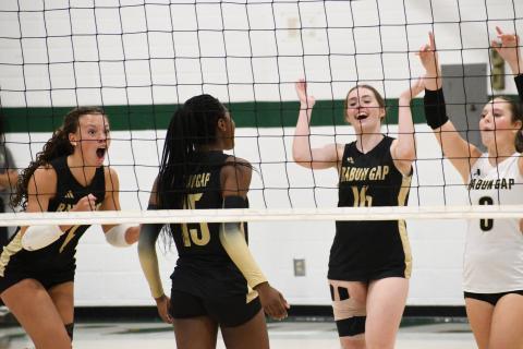 Wesley Branch/The Clayton Tribune. RGNS girls volleyball team celebrates after a point during its 3-1 win versus Swain County on Sept. 28. The RGNS girls improved to 7-11 with the win, and have gone 7-4 in their last 11 matches after an 0-7 start.
