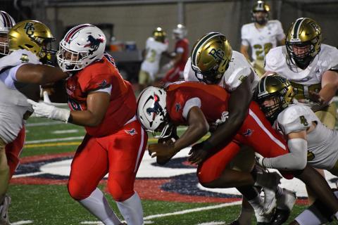 Wesley Branch/The Clayton Tribune. Providence Day quarterback Zaid Lott is tackled by a pair of Rabun Gap defenders during the Sept. 19, 2025, between the foes. This year Eagles and Chargers play at Rabun Gap on Sept. 18 with a 7 p.m. kickoff.